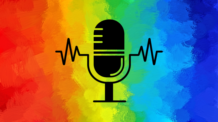 rainbow background with microphone in the foreground