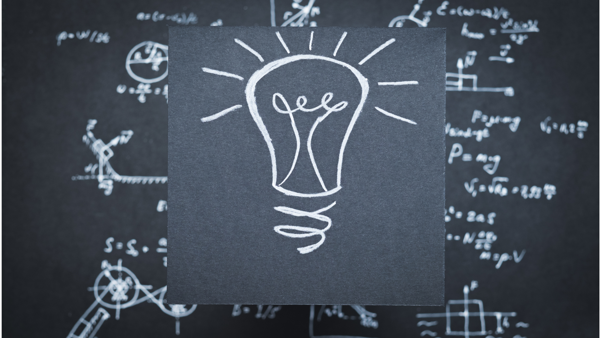 chalkboard with a lightbulb drawn in the middle